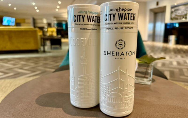 Sustainable hotel Düsseldorf water bottles promoting refill and reuse at Sheraton Düsseldorf.