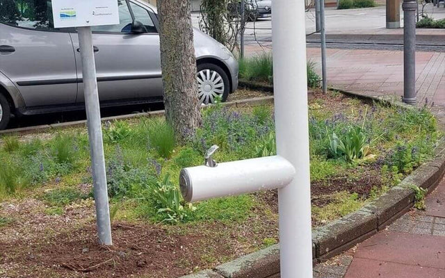 Outdoor water fountain in Germany, showcasing a modern design for public water access.